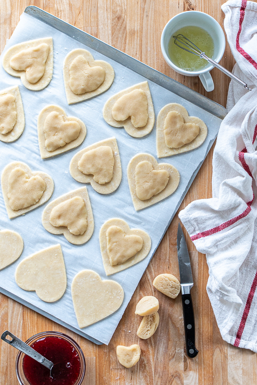 Jammy Almond Hand Pies feature nutty almond filling and fruity jam tucked inside flaky pastry dough. Shaped like hearts, they're perfect for Valentine's Day!