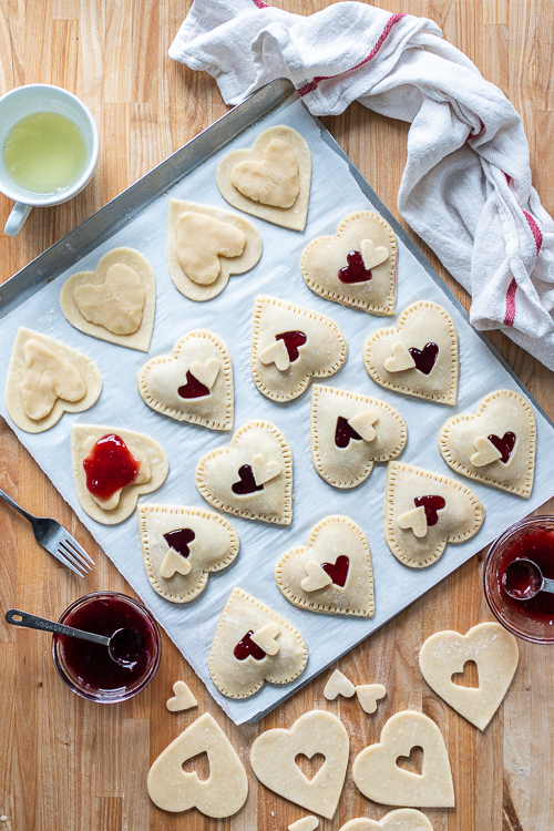 Jammy Almond Hand Pies feature nutty almond filling and fruity jam tucked inside flaky pastry dough. Shaped like hearts, they're perfect for Valentine's Day!