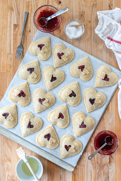 Jammy Almond Hand Pies feature nutty almond filling and fruity jam tucked inside flaky pastry dough. Shaped like hearts, they're perfect for Valentine's Day!