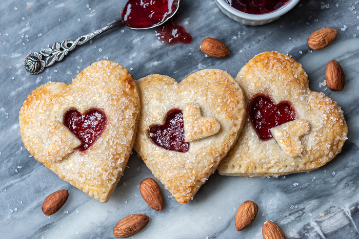 Jammy Almond Hand Pies Jammy Almond Hand Pies feature nutty almond filling and fruity jam tucked inside flaky pastry dough. Shaped like hearts, they're perfect for Valentine's Day!