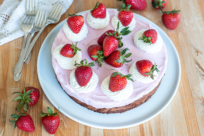 This simple, easy-to-prepare Strawberry Ice Cream Cake features a decadent, fudgy chocolate cake topped with sweet, fruity ice cream.  